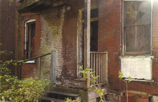 run down exterior of an abandoned brick building