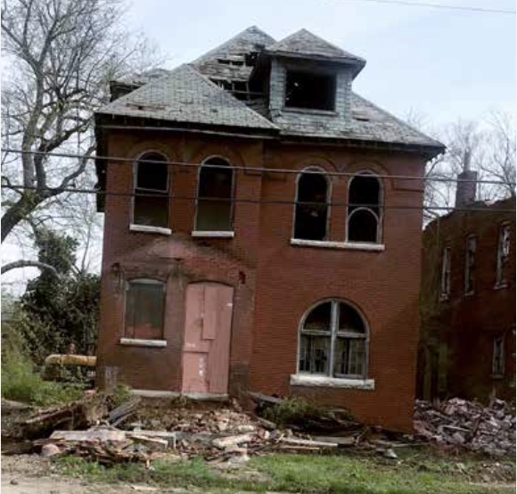 3855 Lee Ave abandoned brick home in St. Louis, recently successfully demolished through the Crime Commission's vacancy project
